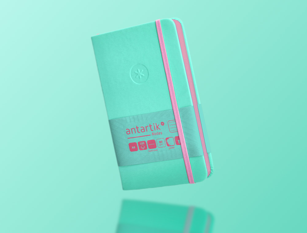 CUADERNO CON GOMILLA ANTARTIK NOTES TAPA DURA A6 HOJAS RAYAS ROSA Y TURQUESA 100 HOJAS 80 GR FSC